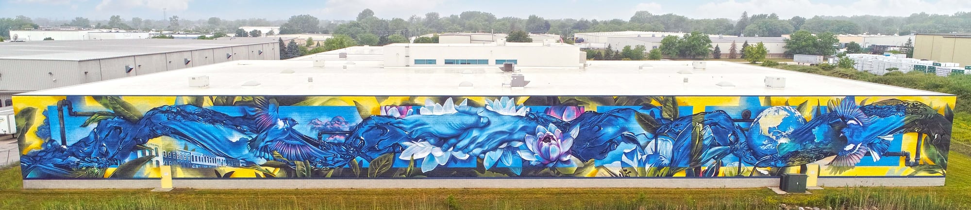 'Beyond the Current': this mural spans 300 feet on the eastern wall of FEDCO's headquarters in Monroe Michigan